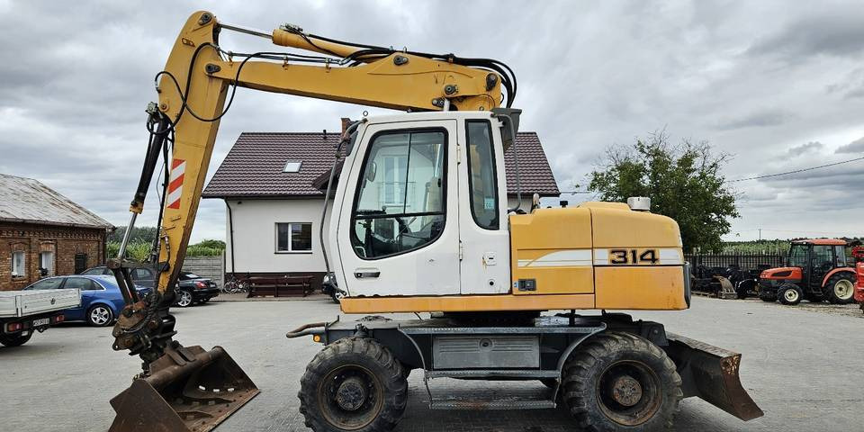 Koparka kołowa Liebherr A314 Litronic 9350 h 4 łyżki kołówka - Ekskavator roda: gambar 1 Koparka kołowa Liebherr A314 Litronic 9350 h 4 łyżki kołówka - Ekskavator roda: gambar 1