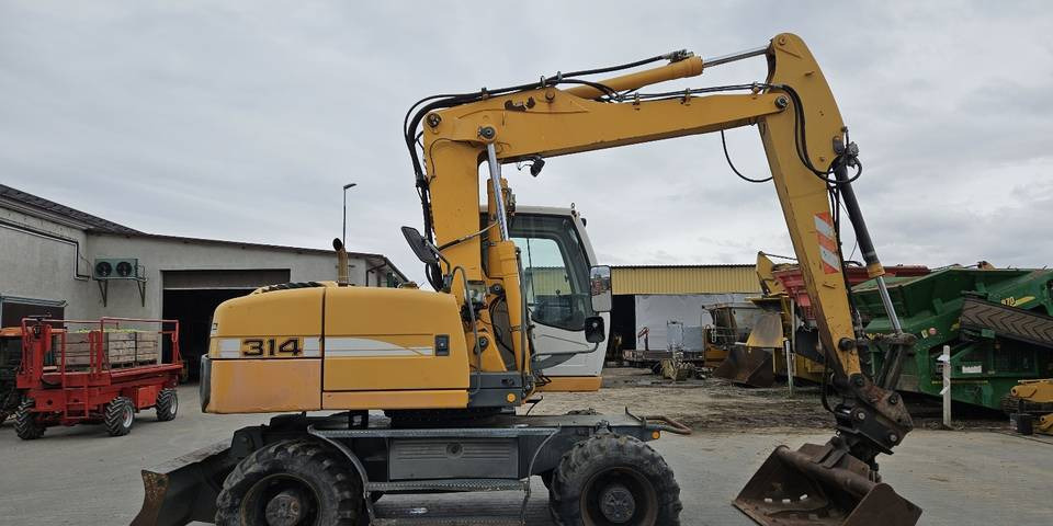 Koparka kołowa Liebherr A314 Litronic 9350 h+ 5 łyżek kołówka - Ekskavator roda: gambar 5 Koparka kołowa Liebherr A314 Litronic 9350 h+ 5 łyżek kołówka - Ekskavator roda: gambar 5