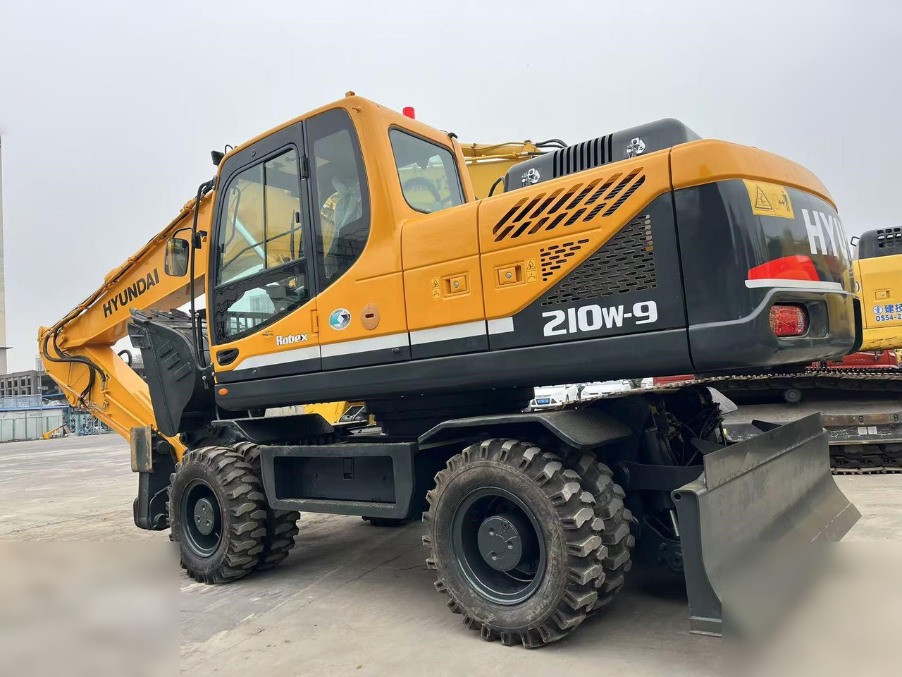 HYUNDAI ROBEX 210W-9S - Ekskavator roda: gambar 1 HYUNDAI ROBEX 210W-9S - Ekskavator roda: gambar 1