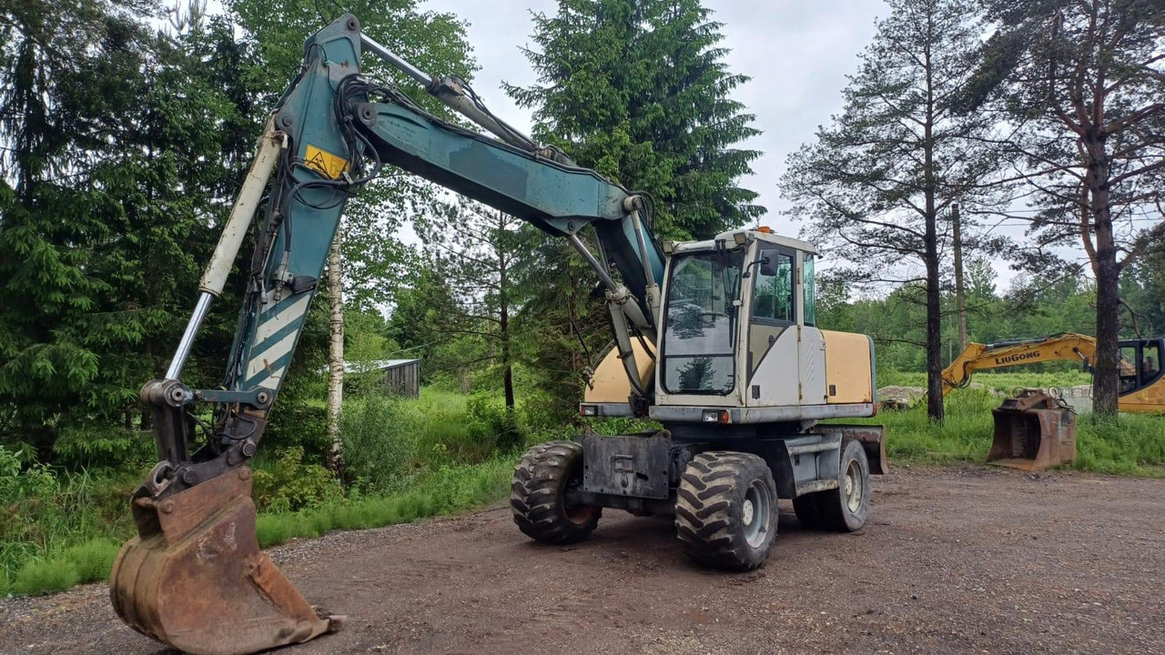 Volvo EW140 - Ekskavator roda: gambar 1 Volvo EW140 - Ekskavator roda: gambar 1