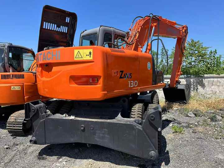 Used Wheel Excavator Hitachi ZX 130W Made in Japan 13ton Hitachi Zx130w Wheel Excavator Price Used Hitachi Zx130 Excavator SALE - Ekskavator roda: gambar 2 Used Wheel Excavator Hitachi ZX 130W Made in Japan 13ton Hitachi Zx130w Wheel Excavator Price Used Hitachi Zx130 Excavator SALE - Ekskavator roda: gambar 2