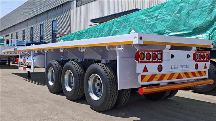 TITAN 40ft Tri Axle Flatbed Semi Trailer for Sale Price In Nigeria Lagos - Semi-trailer pengangkut mobil: gambar 3 TITAN 40ft Tri Axle Flatbed Semi Trailer for Sale Price In Nigeria Lagos - Semi-trailer pengangkut mobil: gambar 3