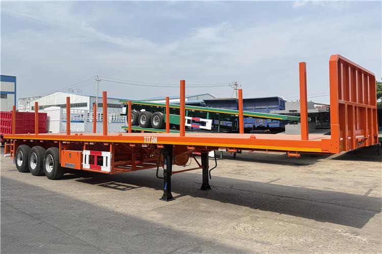 TITAN Container Flatbed Truck Trailer with Piles In Angola - Semi-trailer pengangkut mobil: gambar 1 TITAN Container Flatbed Truck Trailer with Piles In Angola - Semi-trailer pengangkut mobil: gambar 1