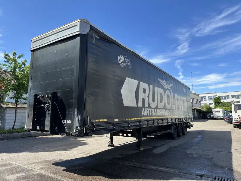 Kögel MEGA Tautliner mit ROLLENBETT Flughafentr. MEGA Tautliner mit ROLLENBETT Flughafentr. - Semi-trailer kotak tertutup: gambar 1 Kögel MEGA Tautliner mit ROLLENBETT Flughafentr. MEGA Tautliner mit ROLLENBETT Flughafentr. - Semi-trailer kotak tertutup: gambar 1