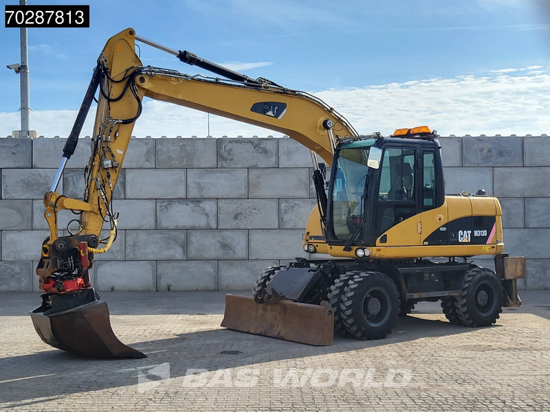 Caterpillar M313 D - Ekskavator roda: gambar 2 Caterpillar M313 D - Ekskavator roda: gambar 2