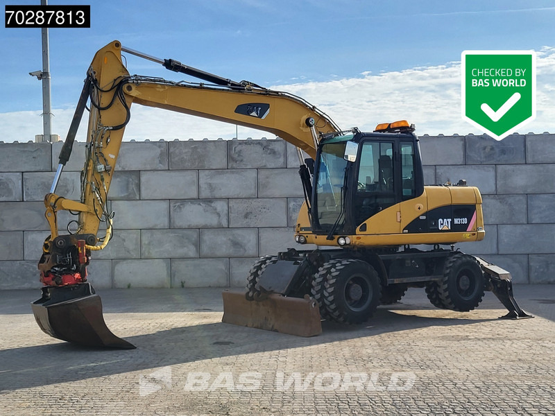 Caterpillar M313 D OUTRIGGERS + BLADE - Ekskavator roda: gambar 1 Caterpillar M313 D OUTRIGGERS + BLADE - Ekskavator roda: gambar 1