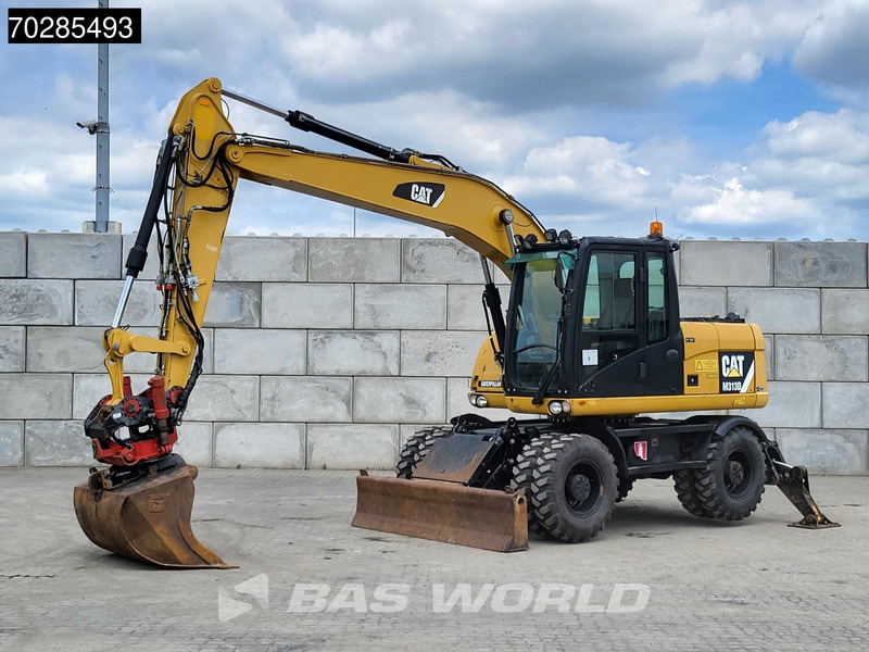 Caterpillar M313 D OUTRIGGERS + ROTOTILT - Ekskavator roda: gambar 2 Caterpillar M313 D OUTRIGGERS + ROTOTILT - Ekskavator roda: gambar 2