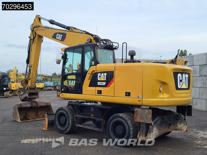 Caterpillar M320 F - Ekskavator roda: gambar 5 Caterpillar M320 F - Ekskavator roda: gambar 5
