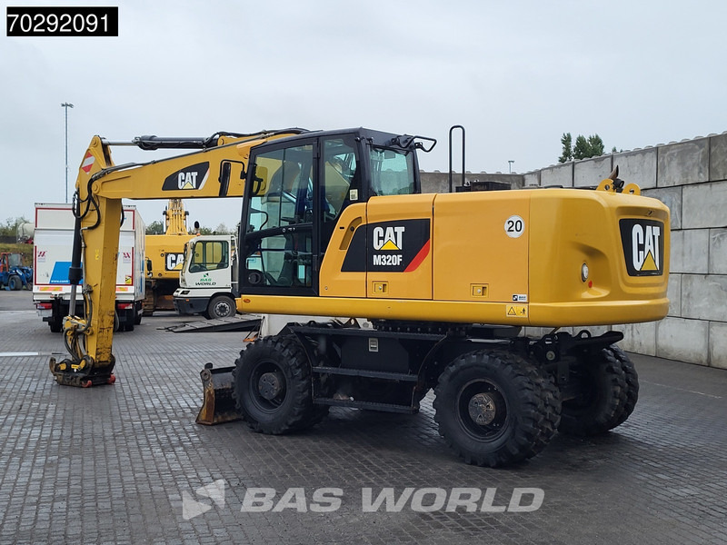 Caterpillar M320 F - Ekskavator roda: gambar 2 Caterpillar M320 F - Ekskavator roda: gambar 2