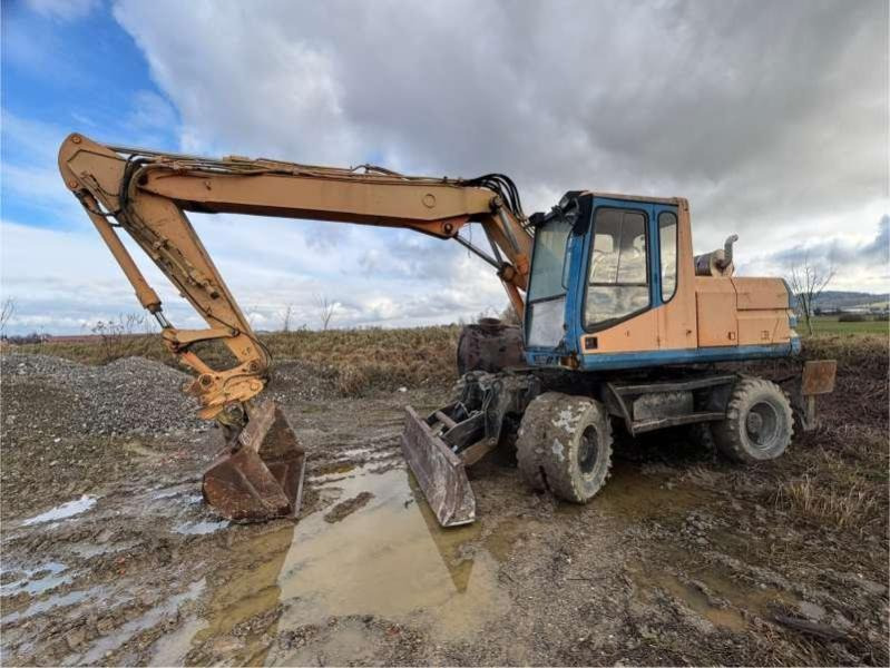 Caterpillar M315 - Ekskavator roda: gambar 1 Caterpillar M315 - Ekskavator roda: gambar 1