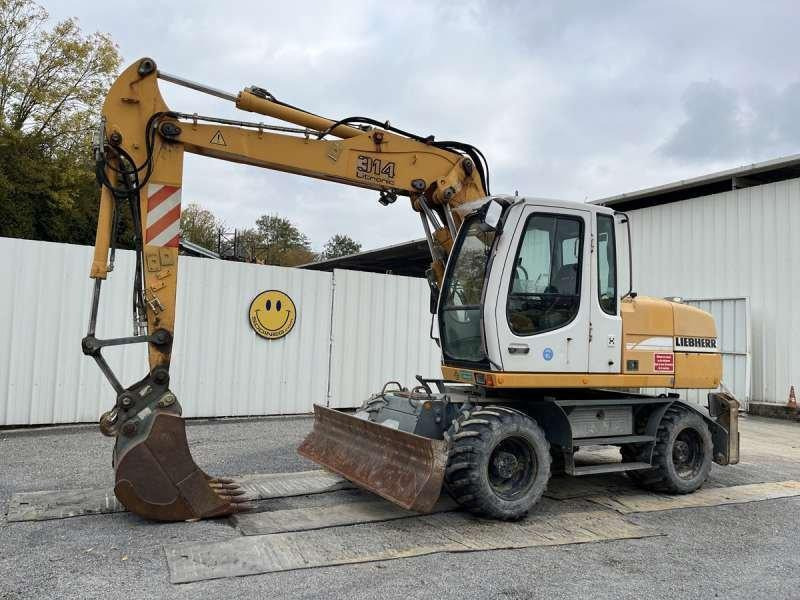 Liebherr A314 Litronic - Ekskavator roda: gambar 1 Liebherr A314 Litronic - Ekskavator roda: gambar 1