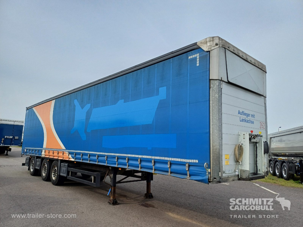 SCHMITZ Auflieger Curtainsider Standard Forklift holder - Semi-trailer dengan terpal samping: gambar 1 SCHMITZ Auflieger Curtainsider Standard Forklift holder - Semi-trailer dengan terpal samping: gambar 1