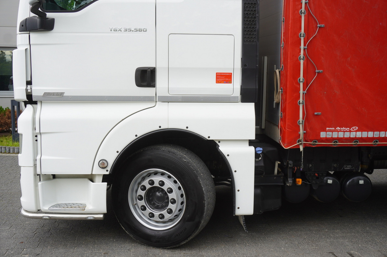 Truk dengan terpal samping MAN TGX 35.580 E6 8x4 /4 / 23 EPAL tarp superstructure / 4th axle steered: gambar 15 Truk dengan terpal samping MAN TGX 35.580 E6 8x4 /4 / 23 EPAL tarp superstructure / 4th axle steered: gambar 15