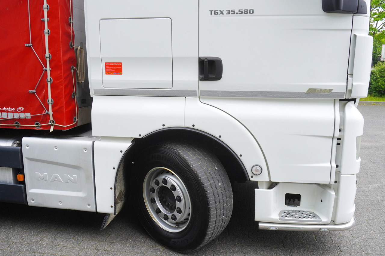 Truk dengan terpal samping MAN TGX 35.580 E6 8x4 /4 / 23 EPAL tarp superstructure / 4th axle steered: gambar 13 Truk dengan terpal samping MAN TGX 35.580 E6 8x4 /4 / 23 EPAL tarp superstructure / 4th axle steered: gambar 13