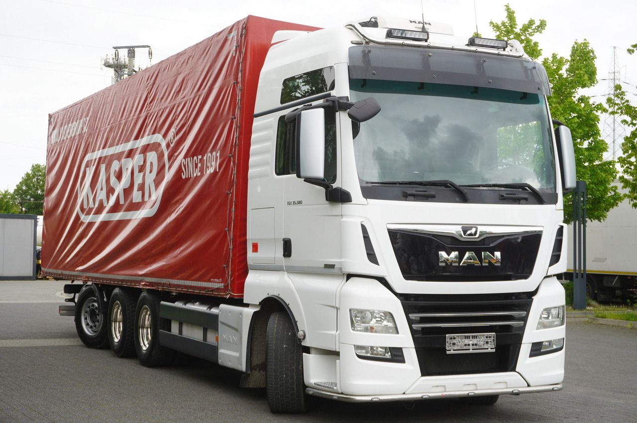 Truk dengan terpal samping MAN TGX 35.580 E6 8x4 /4 / 23 EPAL tarp superstructure / 4th axle steered: gambar 6 Truk dengan terpal samping MAN TGX 35.580 E6 8x4 /4 / 23 EPAL tarp superstructure / 4th axle steered: gambar 6