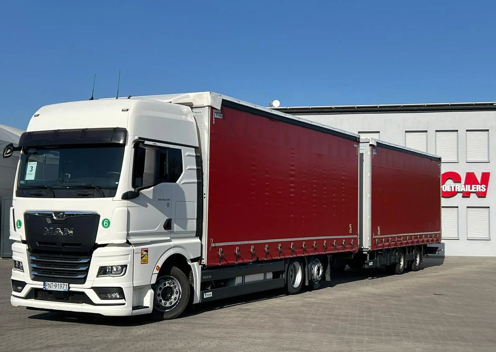 MAN TGX 26.470 z przyczepą Redos - Truk dengan terpal samping: gambar 1 MAN TGX 26.470 z przyczepą Redos - Truk dengan terpal samping: gambar 1