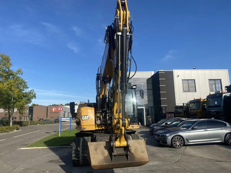 Caterpillar M318F - Ekskavator roda: gambar 2 Caterpillar M318F - Ekskavator roda: gambar 2