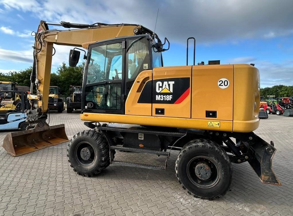 CAT M 318 F - Ekskavator roda: gambar 4 CAT M 318 F - Ekskavator roda: gambar 4