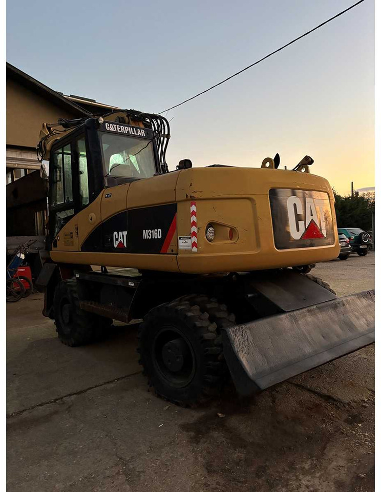 Caterpillar M316D - Ekskavator roda: gambar 5 Caterpillar M316D - Ekskavator roda: gambar 5