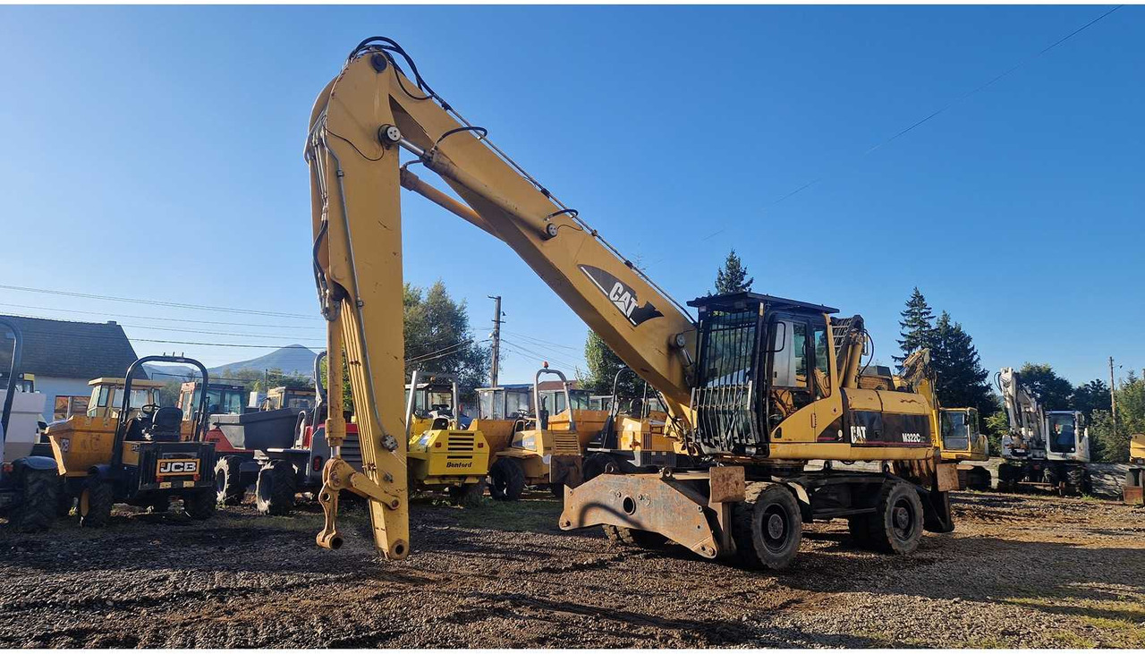 Caterpillar M322C - Ekskavator roda: gambar 1 Caterpillar M322C - Ekskavator roda: gambar 1