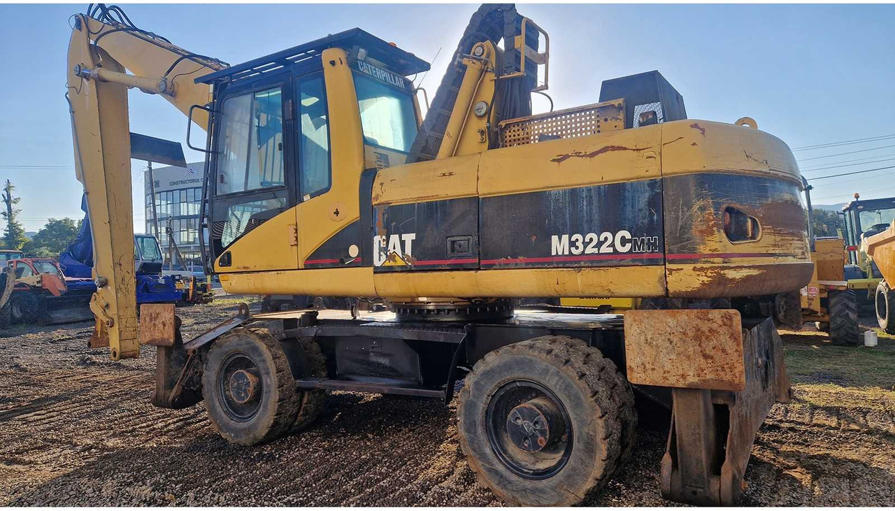 Caterpillar M322C - Ekskavator roda: gambar 5 Caterpillar M322C - Ekskavator roda: gambar 5