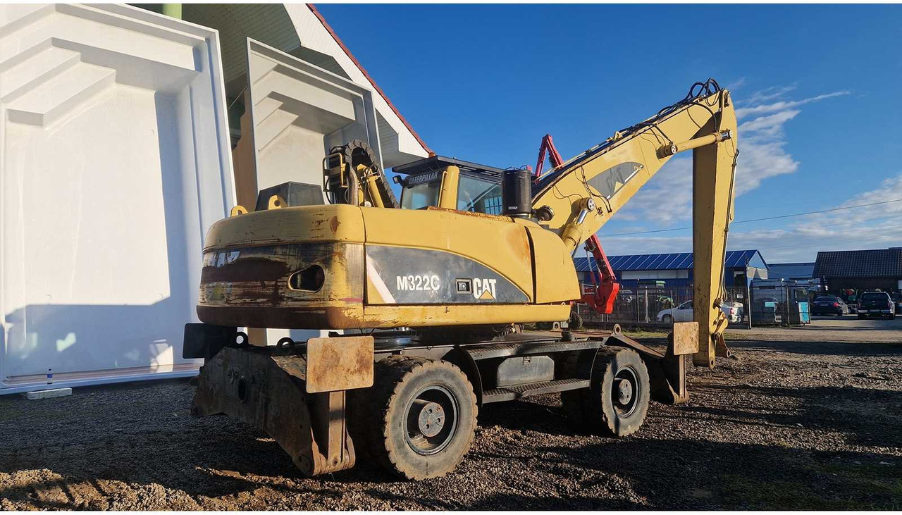 Caterpillar M322C - Ekskavator roda: gambar 3 Caterpillar M322C - Ekskavator roda: gambar 3