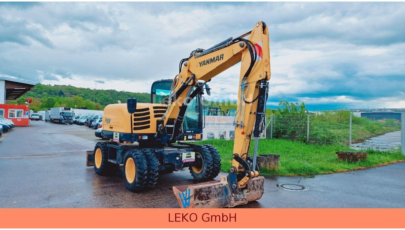 Yanmar B 95W Mit Drei Löffeln und Ein Hammer - Ekskavator roda: gambar 1 Yanmar B 95W Mit Drei Löffeln und Ein Hammer - Ekskavator roda: gambar 1