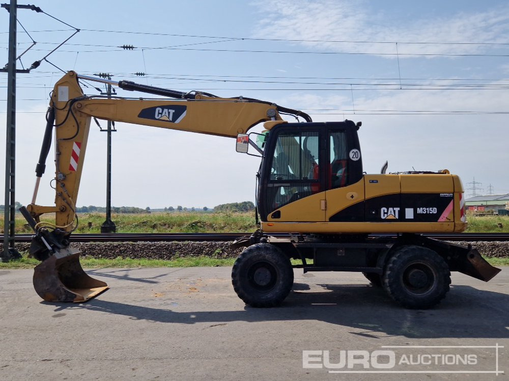 CAT M315D - Ekskavator roda: gambar 2 CAT M315D - Ekskavator roda: gambar 2