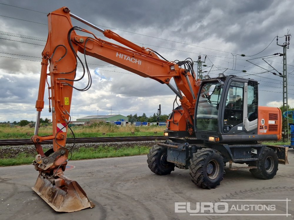 Hitachi ZX140W-3 - Ekskavator roda: gambar 1 Hitachi ZX140W-3 - Ekskavator roda: gambar 1