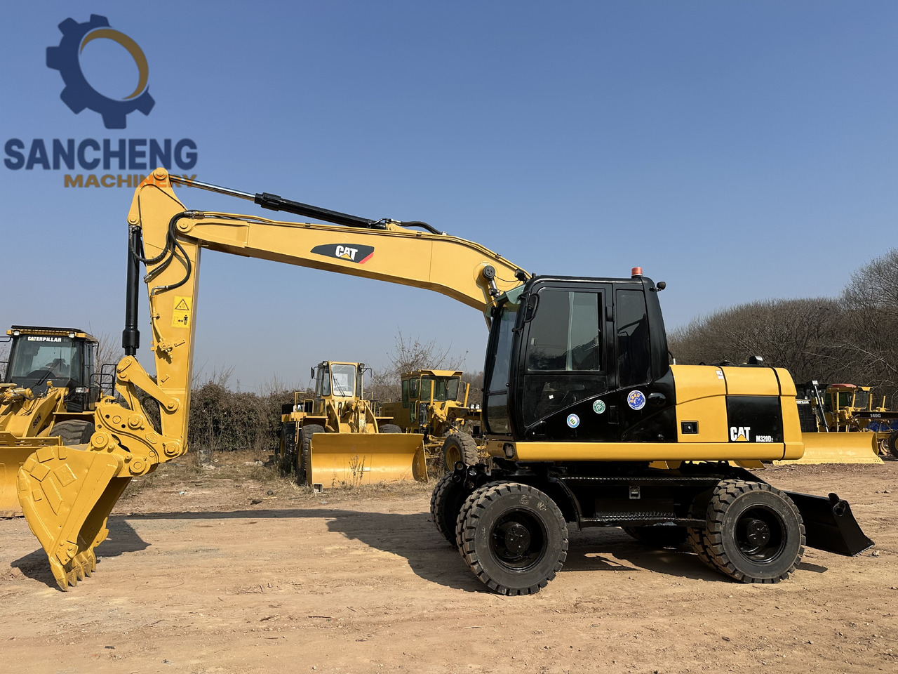 CATERPILLAR M320D2 - Ekskavator roda: gambar 5 CATERPILLAR M320D2 - Ekskavator roda: gambar 5