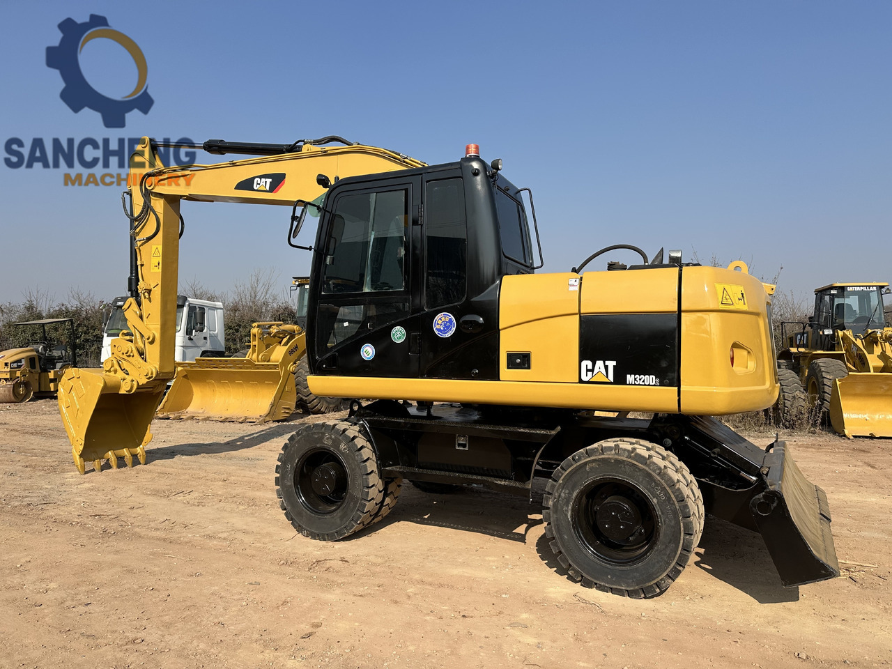 CATERPILLAR M320D2 - Ekskavator roda: gambar 1 CATERPILLAR M320D2 - Ekskavator roda: gambar 1