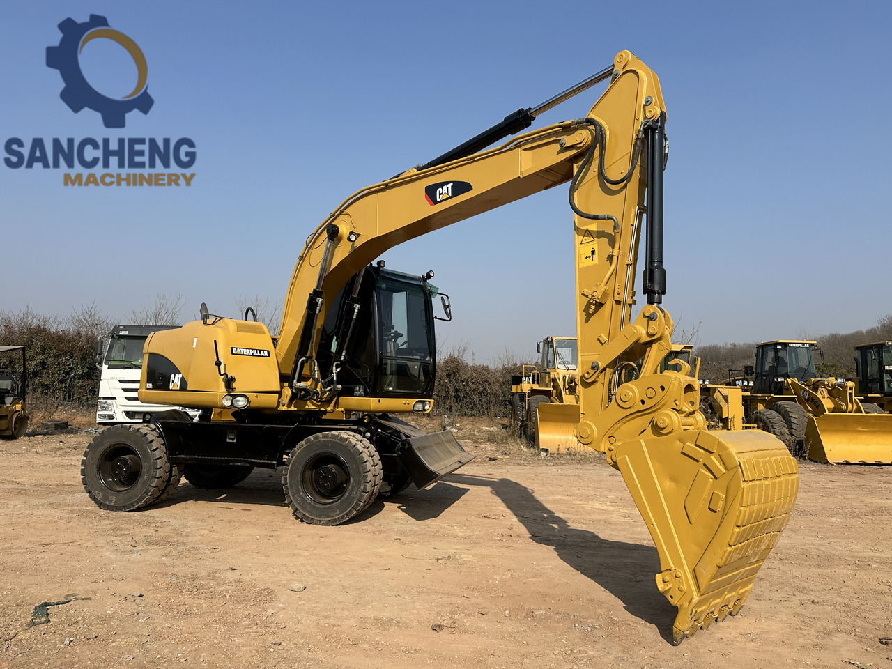 CATERPILLAR M320D2 wheel excavator - Ekskavator roda: gambar 1 CATERPILLAR M320D2 wheel excavator - Ekskavator roda: gambar 1