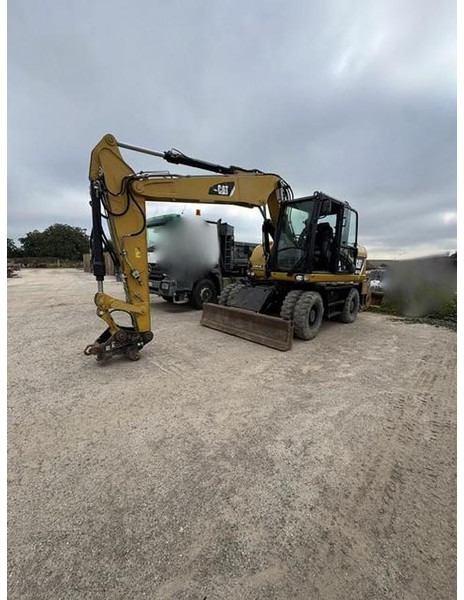 Caterpillar M313D - Ekskavator roda: gambar 1 Caterpillar M313D - Ekskavator roda: gambar 1