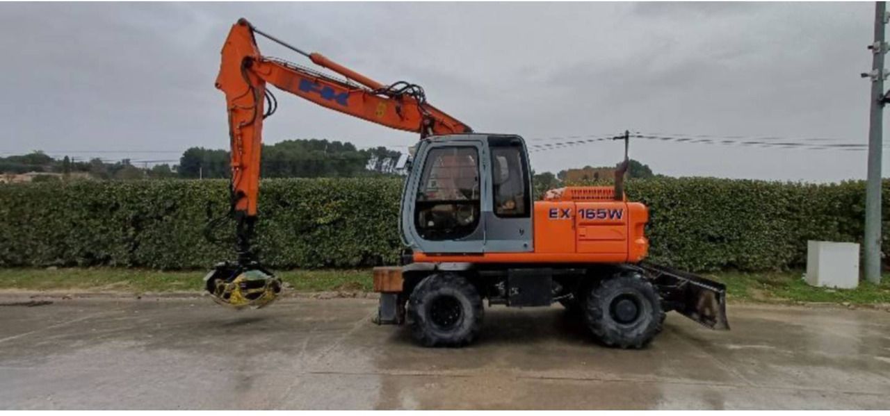 FIAT ALLIS / NEW HOLLAND EX165W - Ekskavator roda: gambar 1 FIAT ALLIS / NEW HOLLAND EX165W - Ekskavator roda: gambar 1