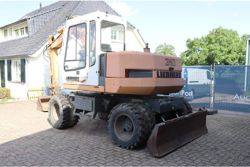 Liebherr A 310 - Ekskavator roda: gambar 4 Liebherr A 310 - Ekskavator roda: gambar 4